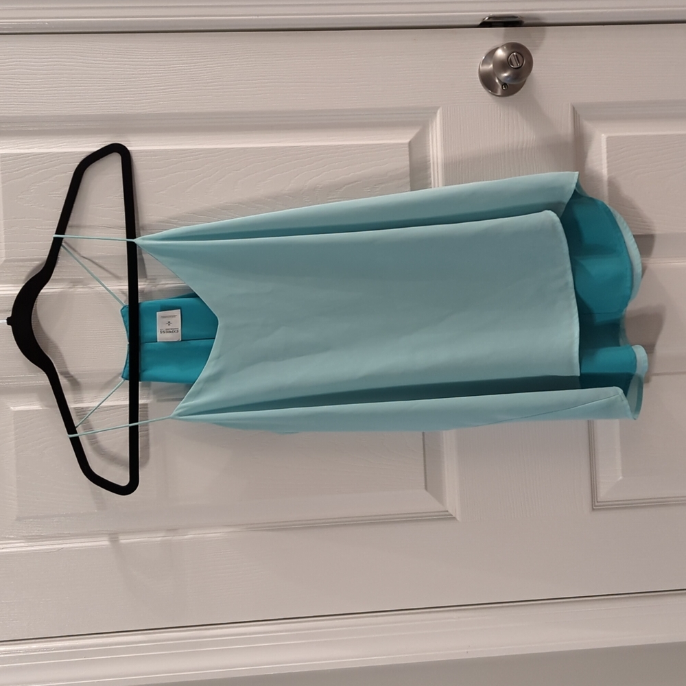 Light blue and turquoise reversible sleeveless blouse